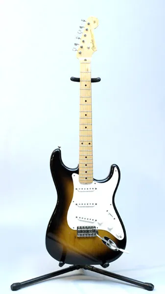 Two-tone sunburst Stratocaster with a maple neck on a stand