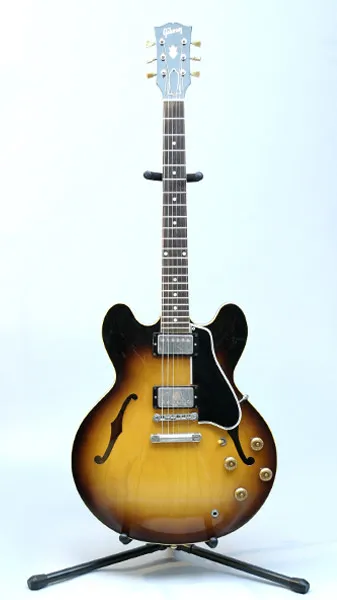 Sunburst semi-hollow Gibson ES-335 on a stand