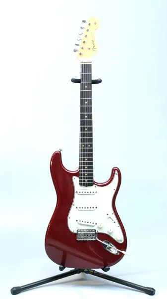 Candy Apple Red Stratocaster on a stand