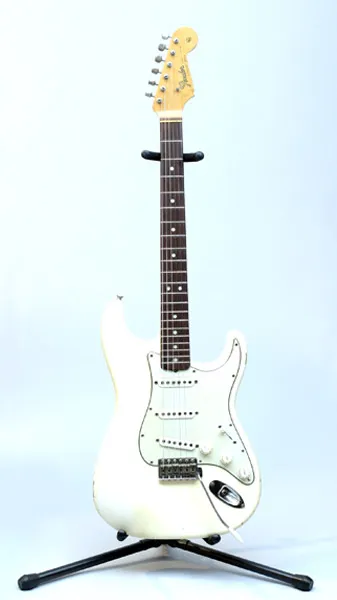 Olympic White Stratocaster on a stand