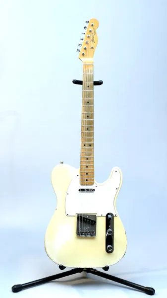 Blonde Telecaster with a maple cap neck on a stand