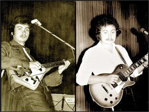 Two young guitarists performing on stage in the 1970s