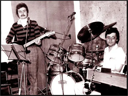 Jan playing with his band in a rehearsal room in the 1980s