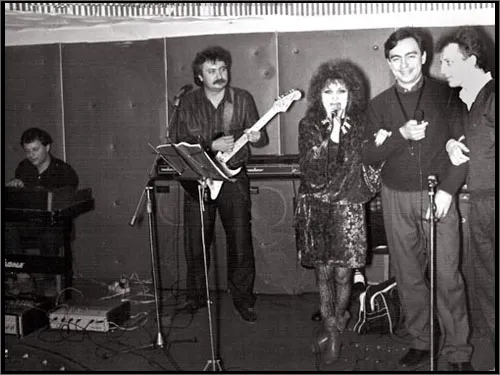 Jan's band on stage with a singer in the 1980s