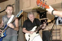 Jan playing a white Stratocaster with friends
