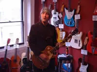 A guitarist from Oasis playing Jan's Gold Top Les Paul