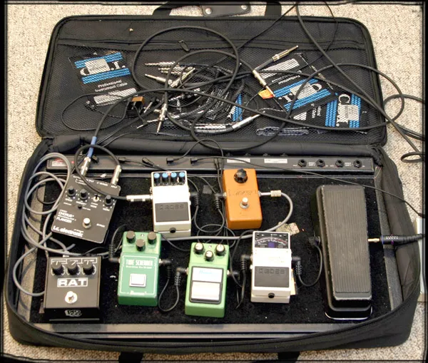 A pedalboard wired up in its case